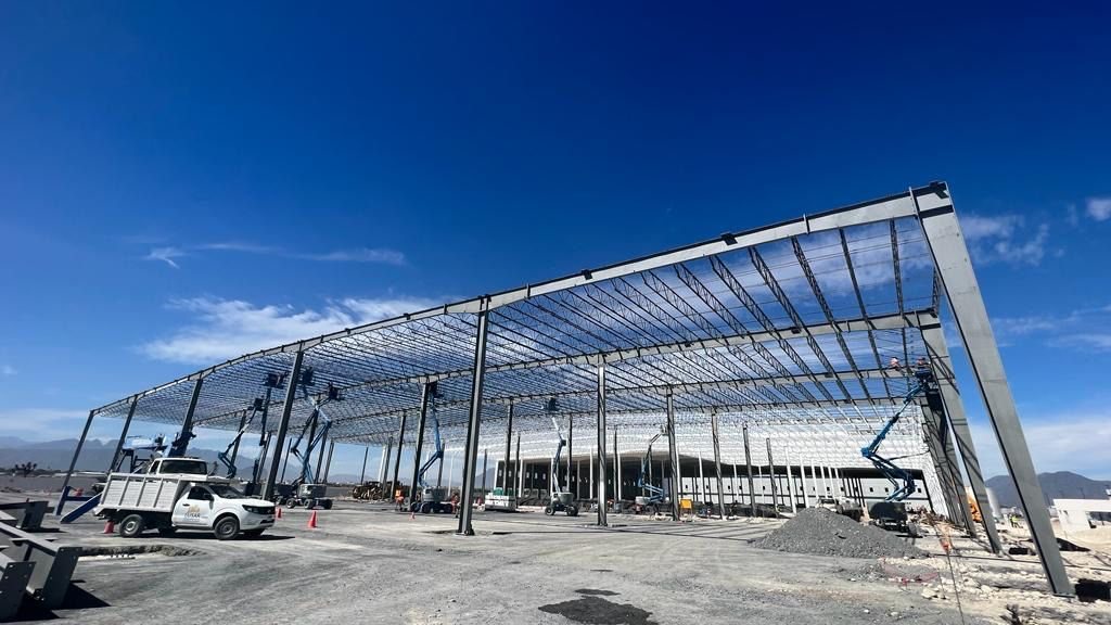 Open clear-span interior of an industrial steel building